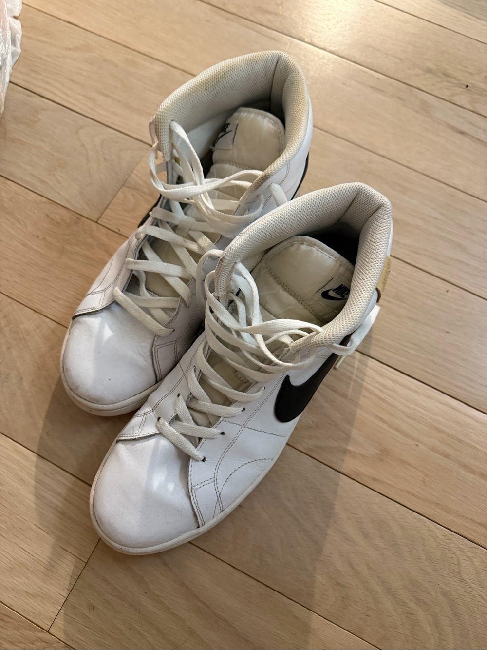 Nike Men’s White High-Top Sneakers with Black Swoosh Accent